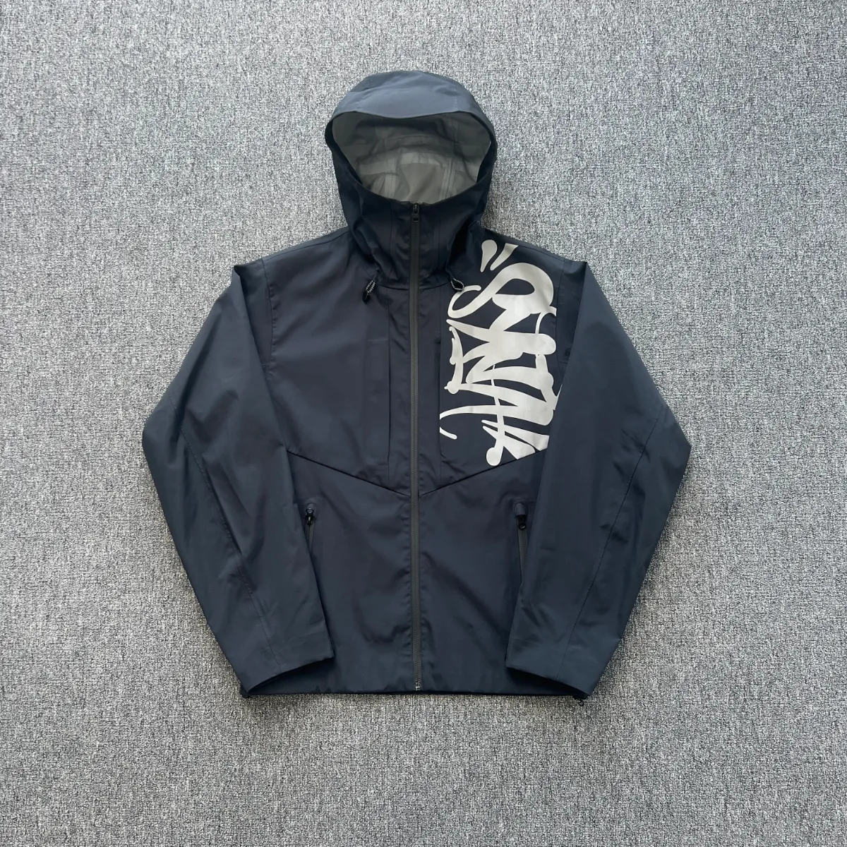 Syna World Graffiti Print Hooded Waterproof Jacket · Syna World