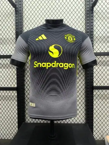 Manchester United Football Club training / pre-match jersey designed by the sports brand adidas · Adidas