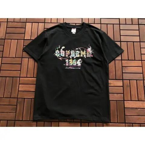 Supreme T-Shirt featuring a cartoon-style graffiti design · Supreme