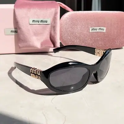 Miu Miu black frame oval vintage sunglasses · Miu Miu