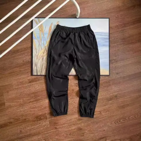 Prada-style nylon jogger pants · Prada