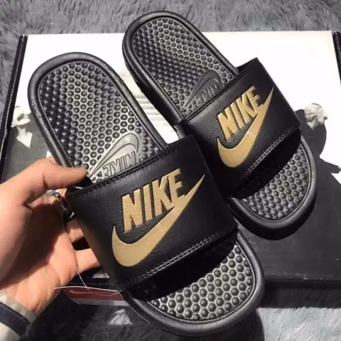 Nike Black and Gold Slide Sandals · Nike